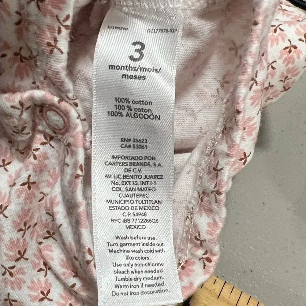 Carter’s pink and white floral long sleeve skirted one piece body suit size 3 m